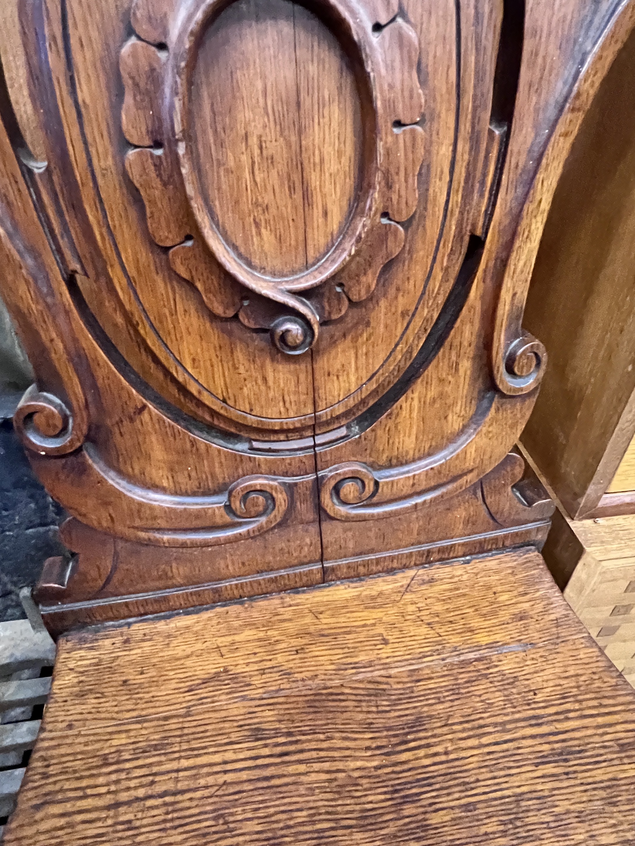 A Victorian oak hall chair